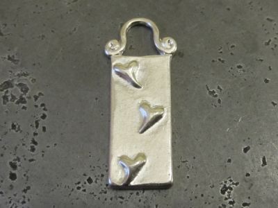 Pendant tile with heart pattern